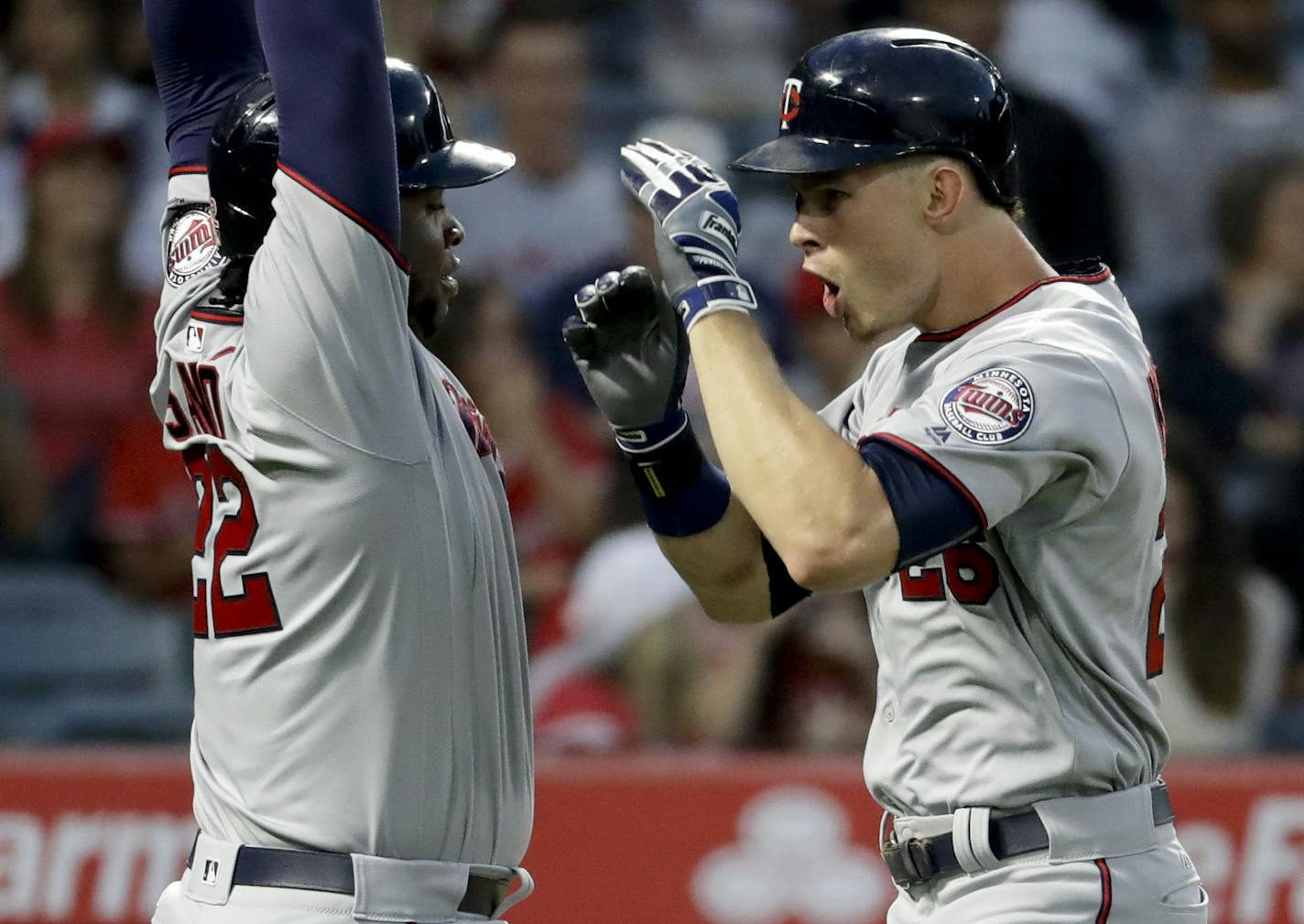 Minnesota Twins' Max Kepler, right, celebrates his two-run home run with Miguel Sano during the third inning of the team's baseball game against the Los Angeles Angels in Anaheim, Calif., Friday, June 2, 2017. (AP Photo/Chris Carlson)