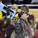 Minnesota head coach Tracy Claeys is doused with a sports drink after winning the Quick Lane Bowl NCAA college football game against Central Michigan,
