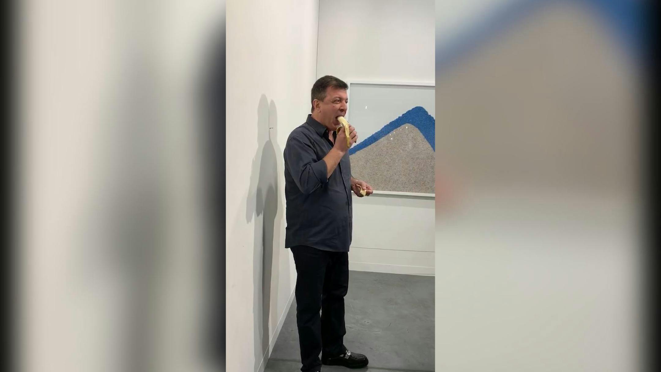 Performance artist David Datuna eats the $120,000 banana. (Courtesy of Gonzalo Fuenmayor/Miami Herald/TNS)