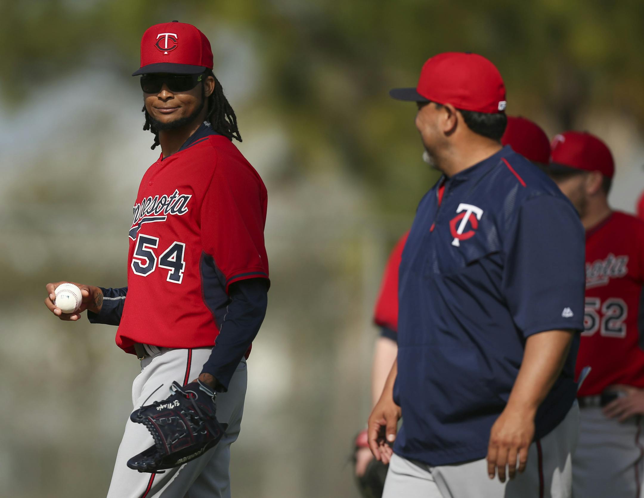 The Twins' Ervin Santana smiled at coach Eddie Guardado before he and some other pitchers started a drill Tuesday morning at Hammond Stadium. ] JEFF WHEELER ï jeff.wheeler@startribune.com Twins pitchers and catchers continued their workouts Tuesday morning, February 24, 2015 at Hammond Stadium in Fort Myers, FL. ORG XMIT: MIN1502241552593804