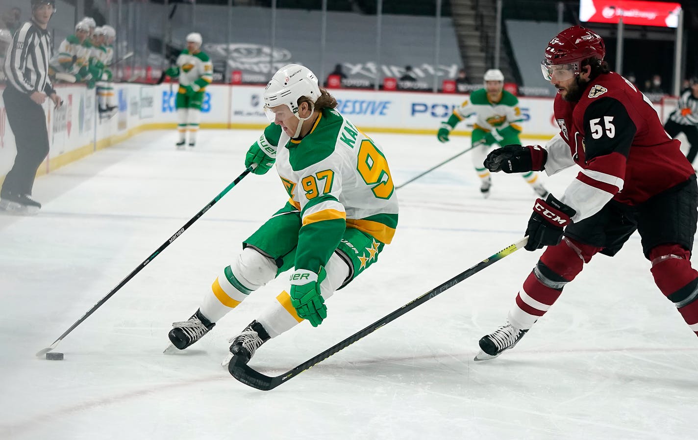 Minnesota Wild left wing Kirill Kaprizov (97) and Arizona Coyotes defenseman Jason Demers (55) battled during the first period. ] LEILA NAVIDI • leila.navidi@startribune.com