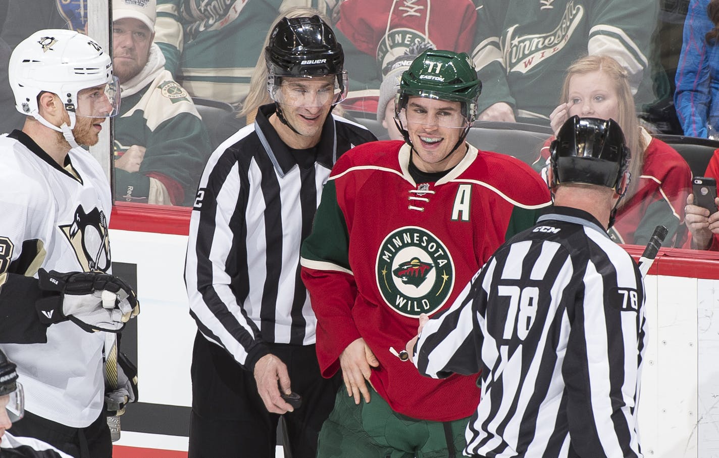 Wild left winger Zach Parise (11) laughed with officials after the puck disappeared into his jersey, temporarily haulting a Wild power play late in the first period against the Penguins.