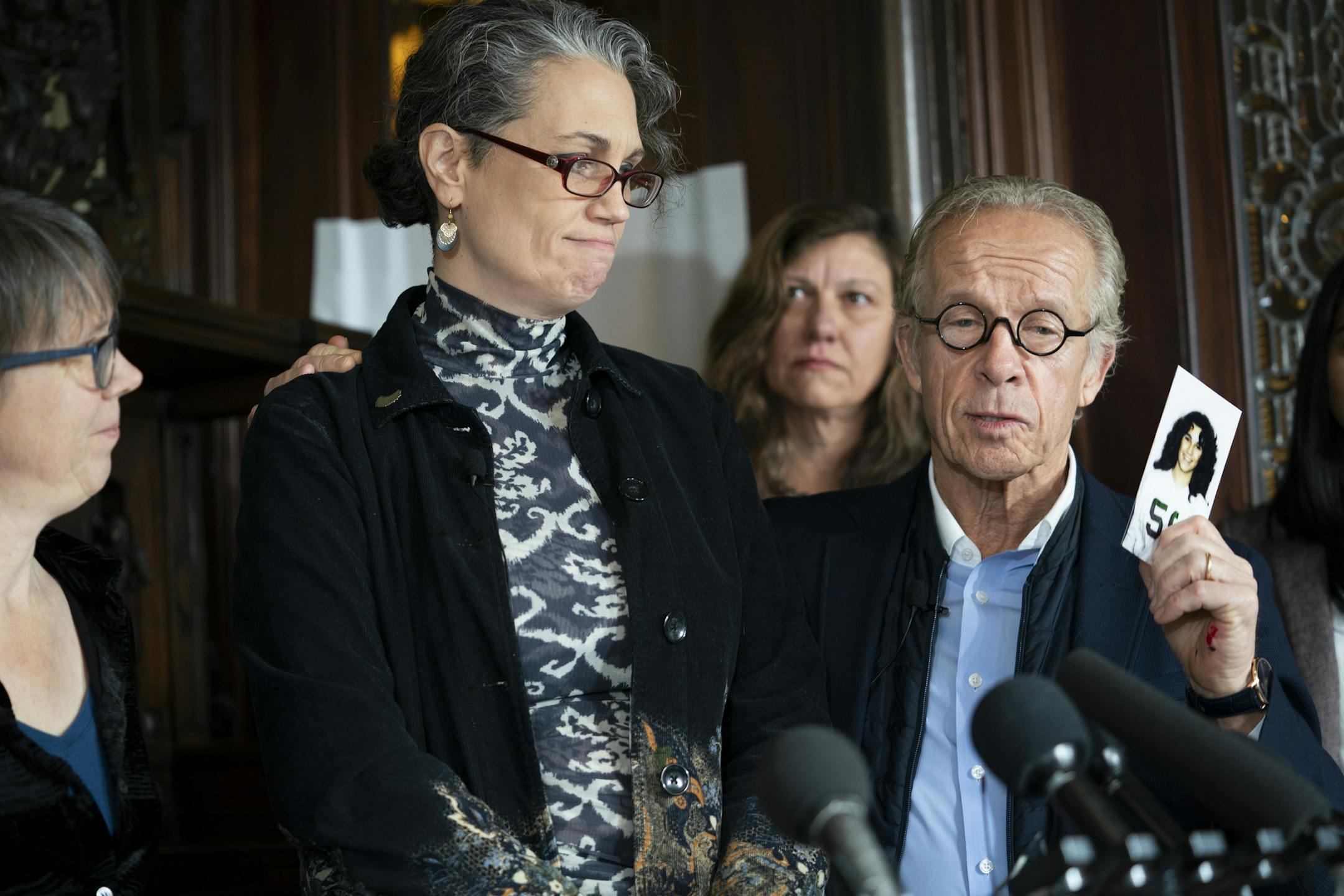 Attorney Jeff Anderson held up a cast photo of Laura Stearns, at left, when she was 13, a year before her sexual abuse started at the Children's Theatre during a press conference at attorney his office after a Minneapolis jury found the Children's Theatre negligent in the sexual abuse of Stearns in the 1980s but did not award damages. The jury also found former Children's Theatre employee and restaurateur Jason McLean liable in the sexual and awarded his victim, Stearns, $3.68 million. Photograp
