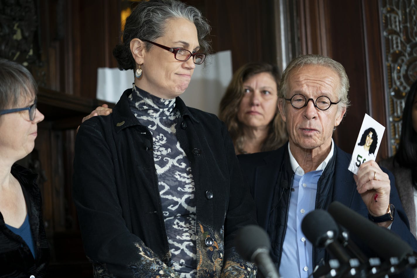 Attorney Jeff Anderson held up a cast photo of Laura Stearns, at left, when she was 13, a year before her sexual abuse started at the Children's Theatre during a press conference at attorney his office after a Minneapolis jury found the Children's Theatre negligent in the sexual abuse of Stearns in the 1980s but did not award damages. The jury also found former Children's Theatre employee and restaurateur Jason McLean liable in the sexual and awarded his victim, Stearns, $3.68 million. Photograp