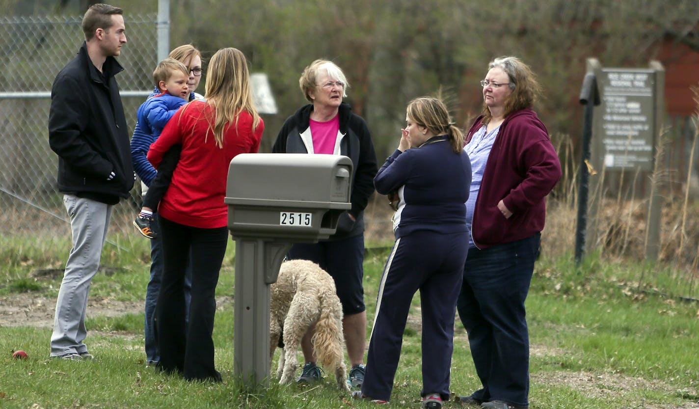 An ongoing dispute between neighbors over feeding deer erupted in gunfire Monday night in New Brighton. One man is dead, another victim is hospitalize. Here, neighbors gathered near the site of the shooting Tuesday, May 6, In New Brighton, MN.](DAVID JOLES/STARTRIBUNE) djoles@startribune An ongoing dispute between neighbors over feeding deer erupted in gunfire Monday night in New Brighton. One man is dead, another victim is hospitalized. Suspect, 57, turned himself into police. ORG XMIT: MIN1405