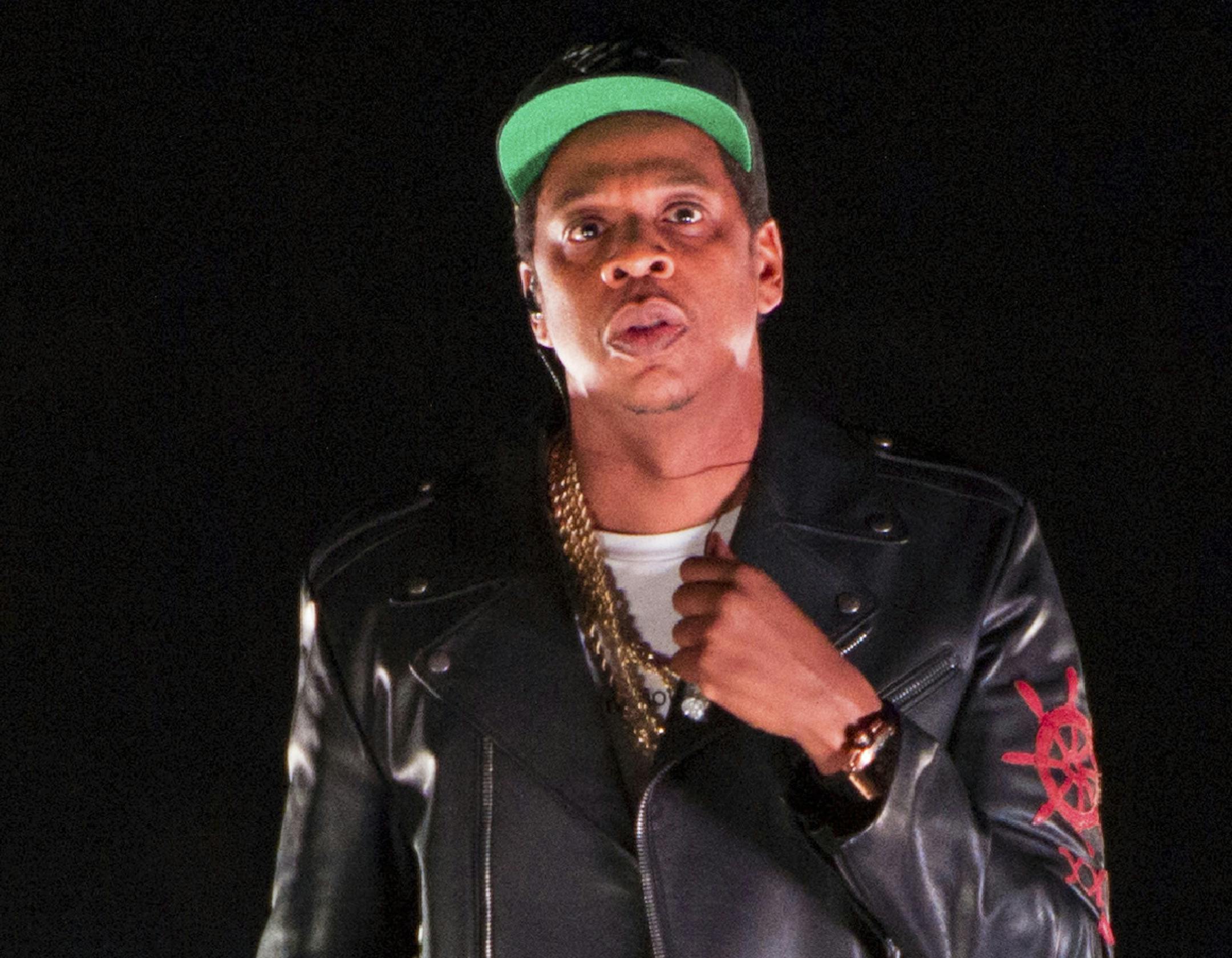 FILE - In this Nov. 26, 2017 file photo, Jay-Z performs on the 4:44 Tour at Barclays Center in New York. Jay-Z's Roc Nation entertainment company is partnering with Brooklyn's Long Island University to launch the Roc Nation School of Music, Sports & Entertainment. The new school will begin enrolling students for the fall 2021 semester, and 25% of the incoming freshmen class will receive Roc Nation Hope Scholarships. (Photo by Scott Roth/Invision/AP, File)