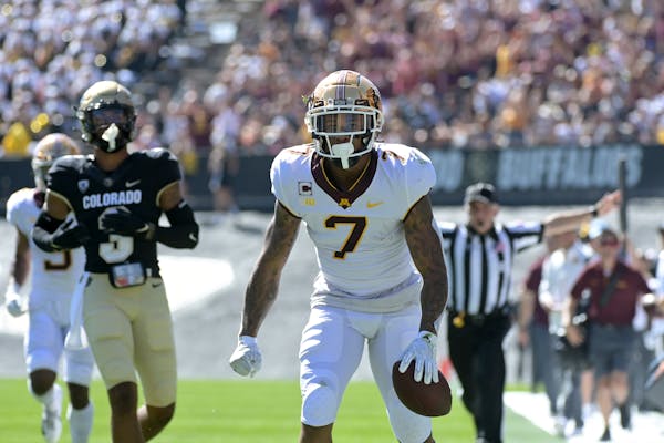 Minnesota Gophers wide receiver Chris Autman-Bell (7) reacted after catching the ball for a first down in the second quarter against the Colorado Buff