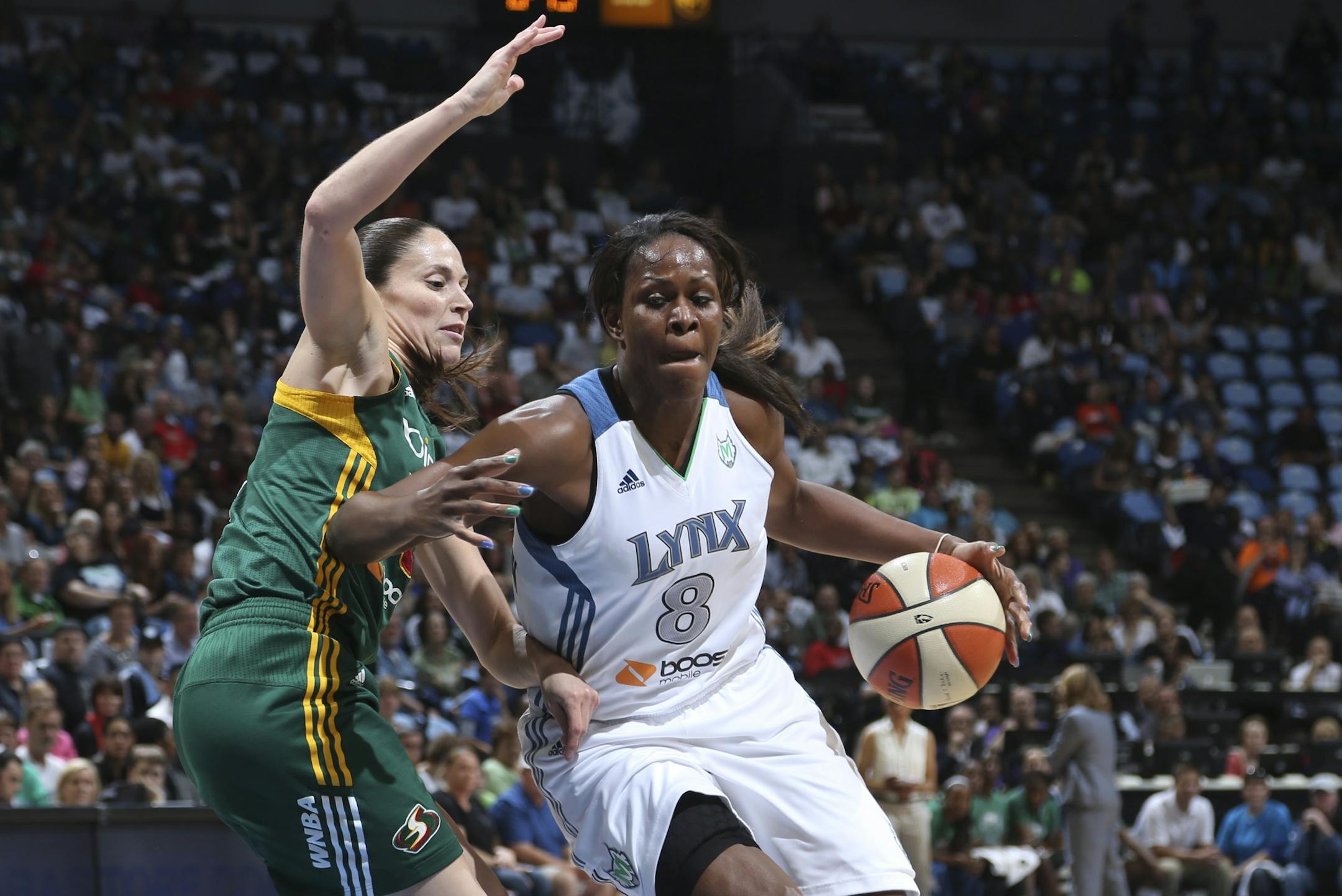 Lynx Taj McWilliams-Franklin drove to the basket against the Storm's Sue Bird in the first quarter during the first game of the WNBA playoffs at Target Center in Minneapolis Min., Friday September 28, 2012.