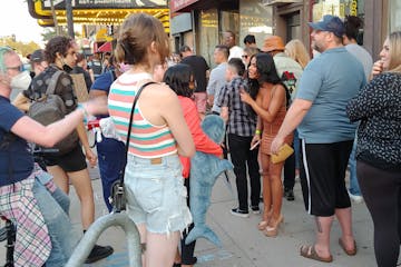 A woman in line for Dave Chappelle’s show at the Varsity Theater in Minneapolis on Wednesday evening had a heated exchange with protesters who viewe