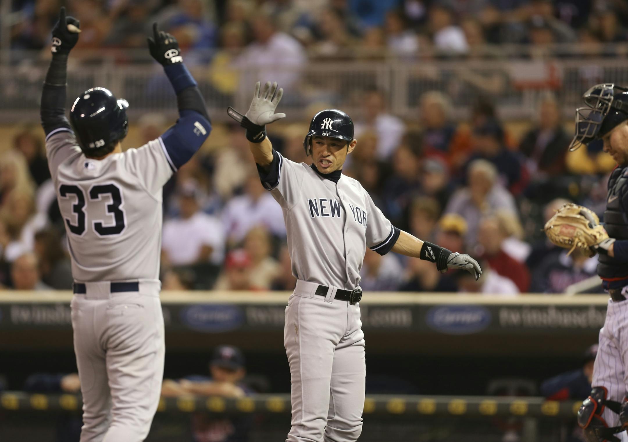 The Yankees' Ichiro Suzuki waited to congratulate Nick Swisher at home after his two-run homer in the first inning.