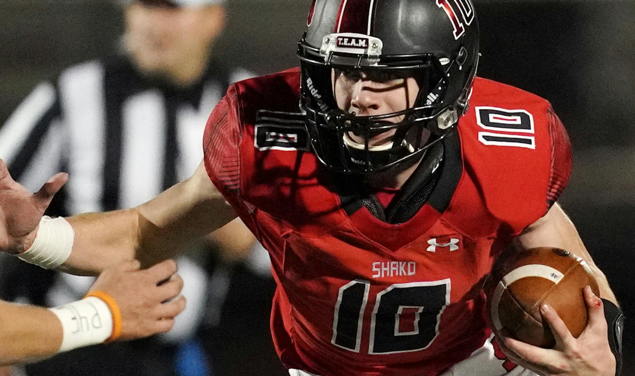 Shakopee quarterback David Bigaouette (10) scrambled in the pocket as he held the ball in the second half. ] ANTHONY SOUFFLE • anthony.souffle@startribune.com Shakopee played Farmington in a Class 6A football state tournament first round game Friday, Oct. 25, 2019 at Vaughan Field in Shakopee, Minn.