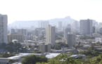 Diamond Head, an extinct volcanic crater, and high-rises are seen in Honolulu on Saturday, Jan. 13, 2018. Minnesotans visiting the sites in Hawaii on 