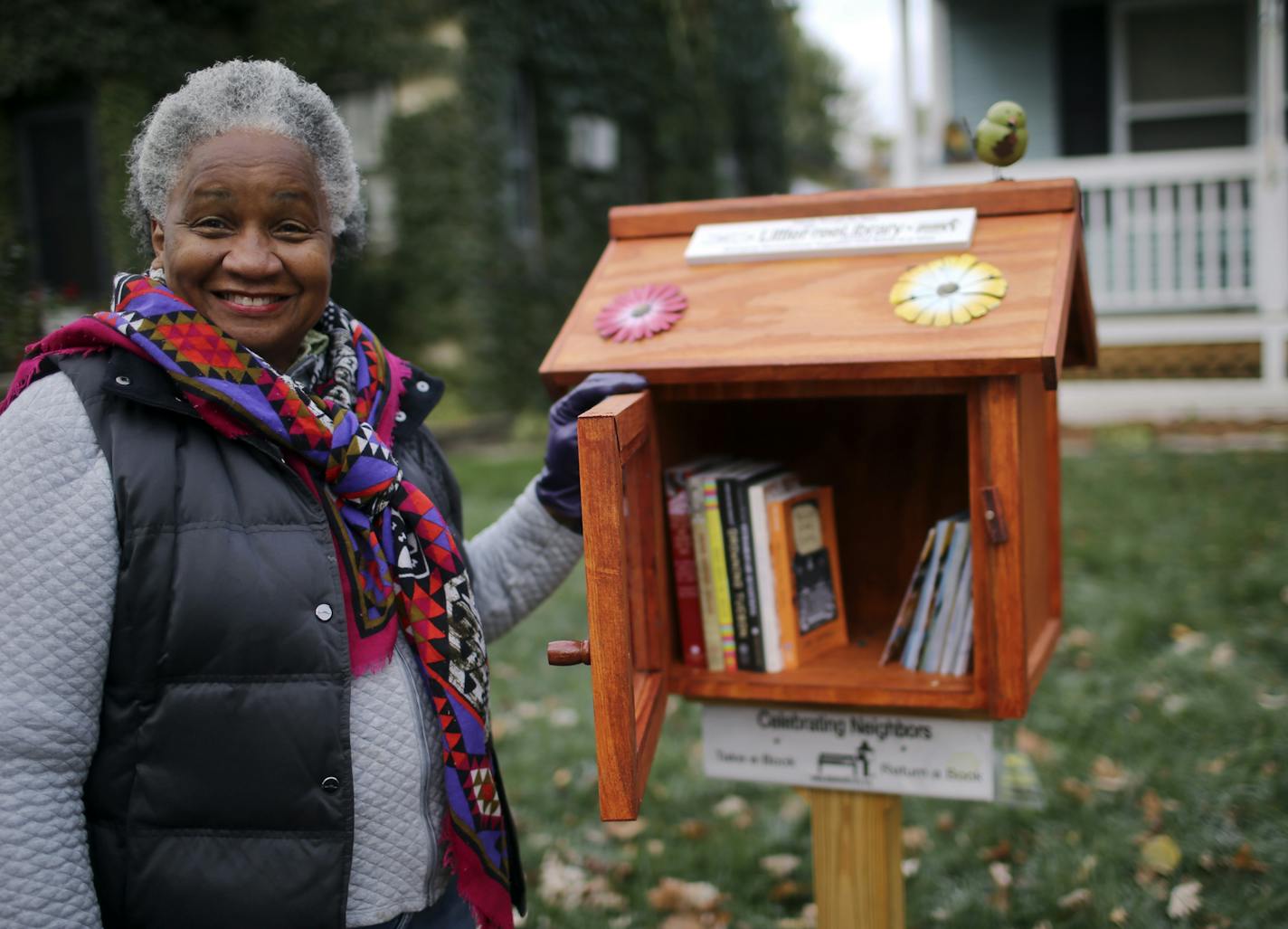 Homeowner Eddye Watkins with a library from the Little Free Libraries program outside her home Tuesday, Oct. 22, 2013, in Minneapolis, MN.](DAVID JOLES/STARTRIBUNE) djoles@startribune.com The first Little Free Libraries was placed a couple of years ago in Hudson, Wis. Now there are more than 10,000 around the world and the phenomenon shows no signs of stopping. Todd Bol, who came up with the idea of Little Free Libraries, installed one of these little dollhouse-sized libraries in Eddye Watkin fr