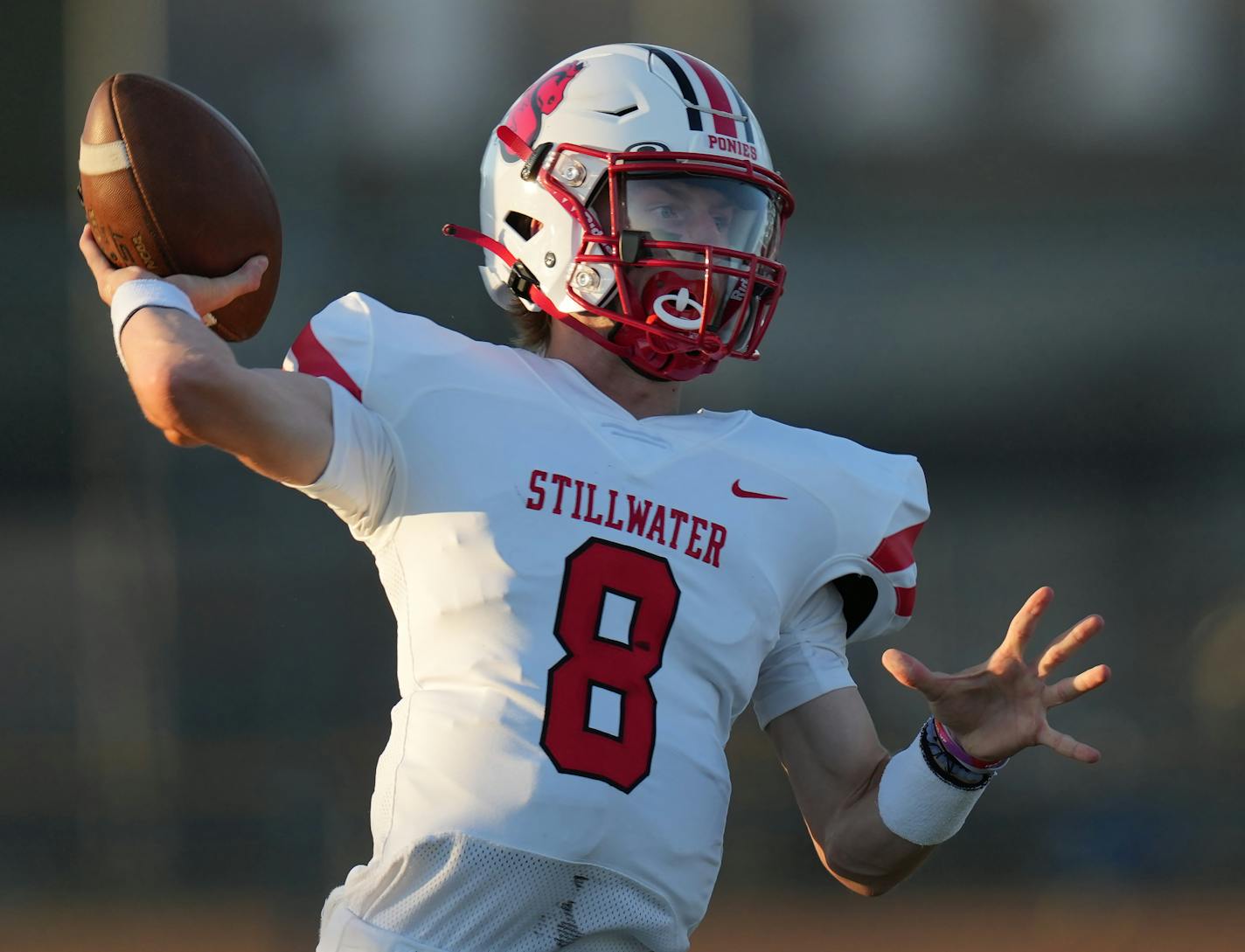 Max Shikenjanski(8) of Stillwater looks for his receiver. Centennial High School football opens at home against Stillwater High School in Circle Pines, Minn., on Thursday, Sept. 1, 2022. Centennial High School football opens at home against Stillwater High School ] RICHARD TSONG-TAATARII • richard.tsong-taatarii@startribune.com