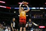 Utah Jazz's Joe Ingles shoots the ball in the first half against the Timberwolves