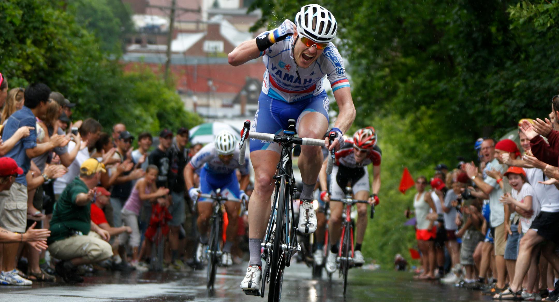 Christian Helmig of the Elbowz team crossed the finish line first to win the Stillwater Criterium, the final stage of the Nature Valley Grand Prix on Sunday. Tom Zirbel was the overall men's winner; Carmen Small was the women's champion.