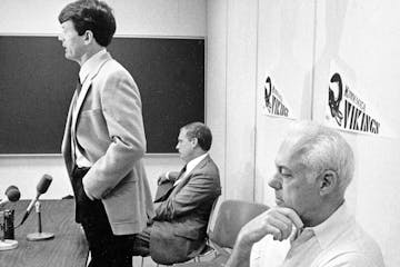 Minnesota Vikings coach Bud Grant, right, seems to have other things on his mind than new Coach Les Steckel's remarks to a press conference at the tea