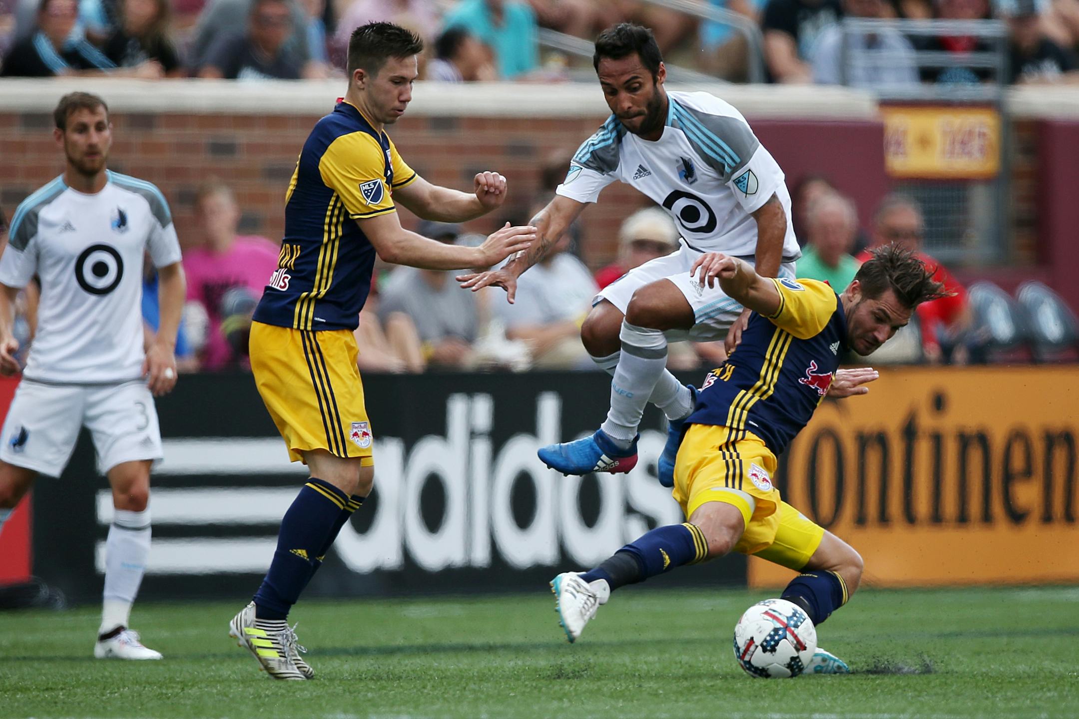 Minnesota United midfielder Ibson (7) got tangled up with New York Red Bulls defender Damien Perrinelle (55) trying to settle a long pass up field in the first half.
