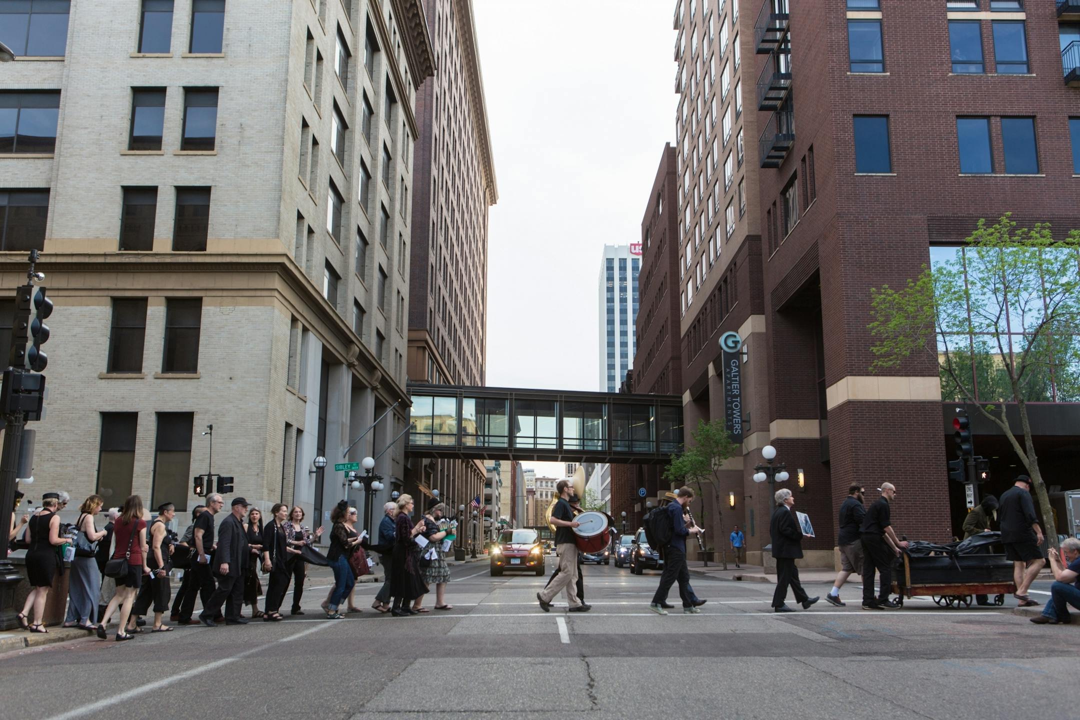 Former Jax building tenants and Lowertown arts supporters hold a wake to honor their longtime artistic quarters. Funeral began at Union Depot and then proceeded to the Jax building