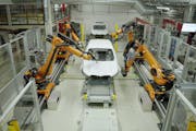 3M’s Finesse-it paint repair system in use at a BMW plant in Germany. “We’ve been automating industrial processes for many, many years,” said 