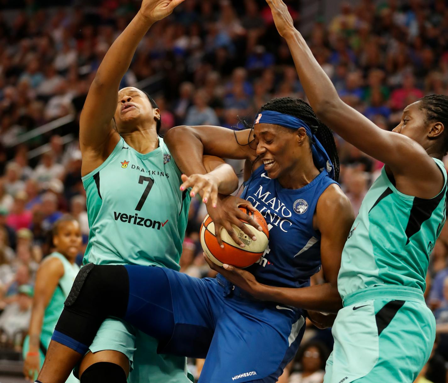 Sylvia Fowles was double-teamed by Kia Vaughn (7) and Tina Charles (31) of the Liberty in the first half.