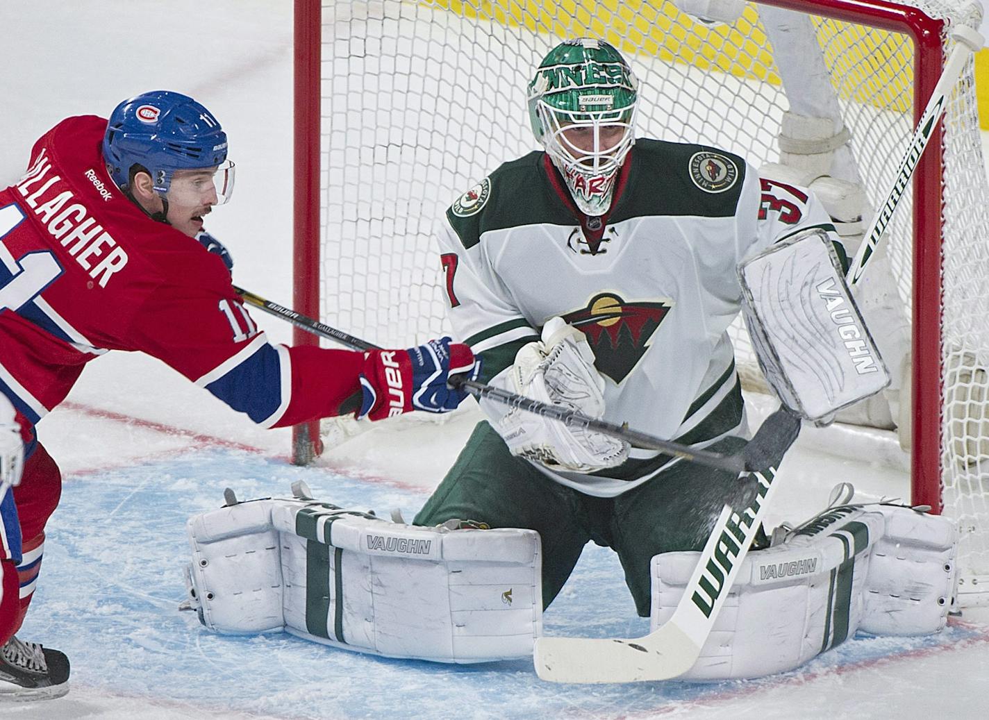 Minnesota Wild's goaltender Josh Harding makes a save against Montreal Canadiens' Brendan Gallagher during the second period of an NHL hockey game, Tuesday, Nov. 19, 2013 in Montreal.