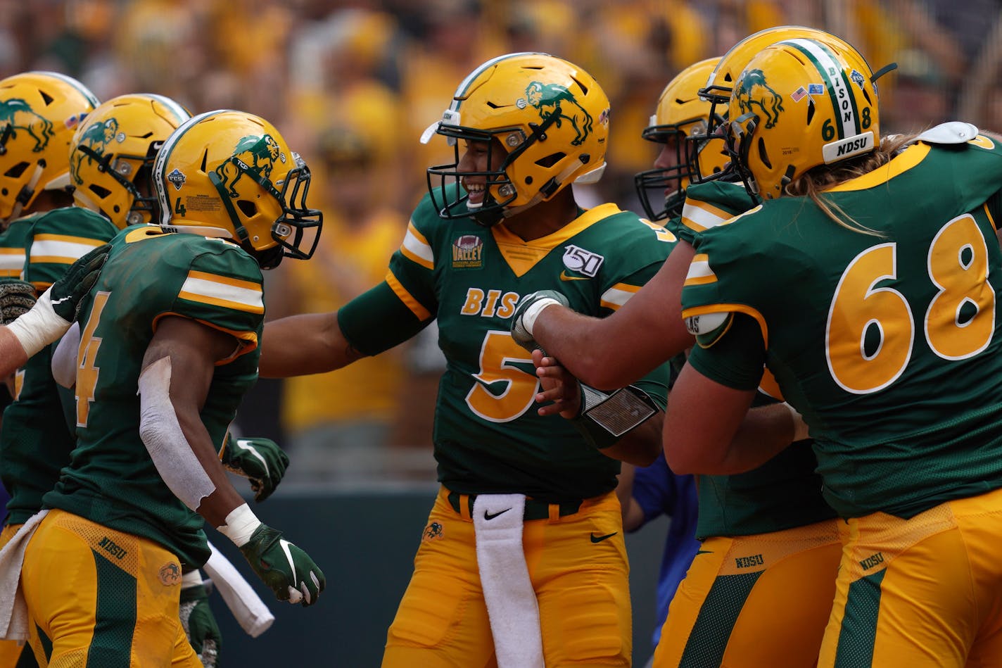 North Dakota State quarterback Trey Lance celebrated with teammates in the end zone after scoring a touchdown in the first half.