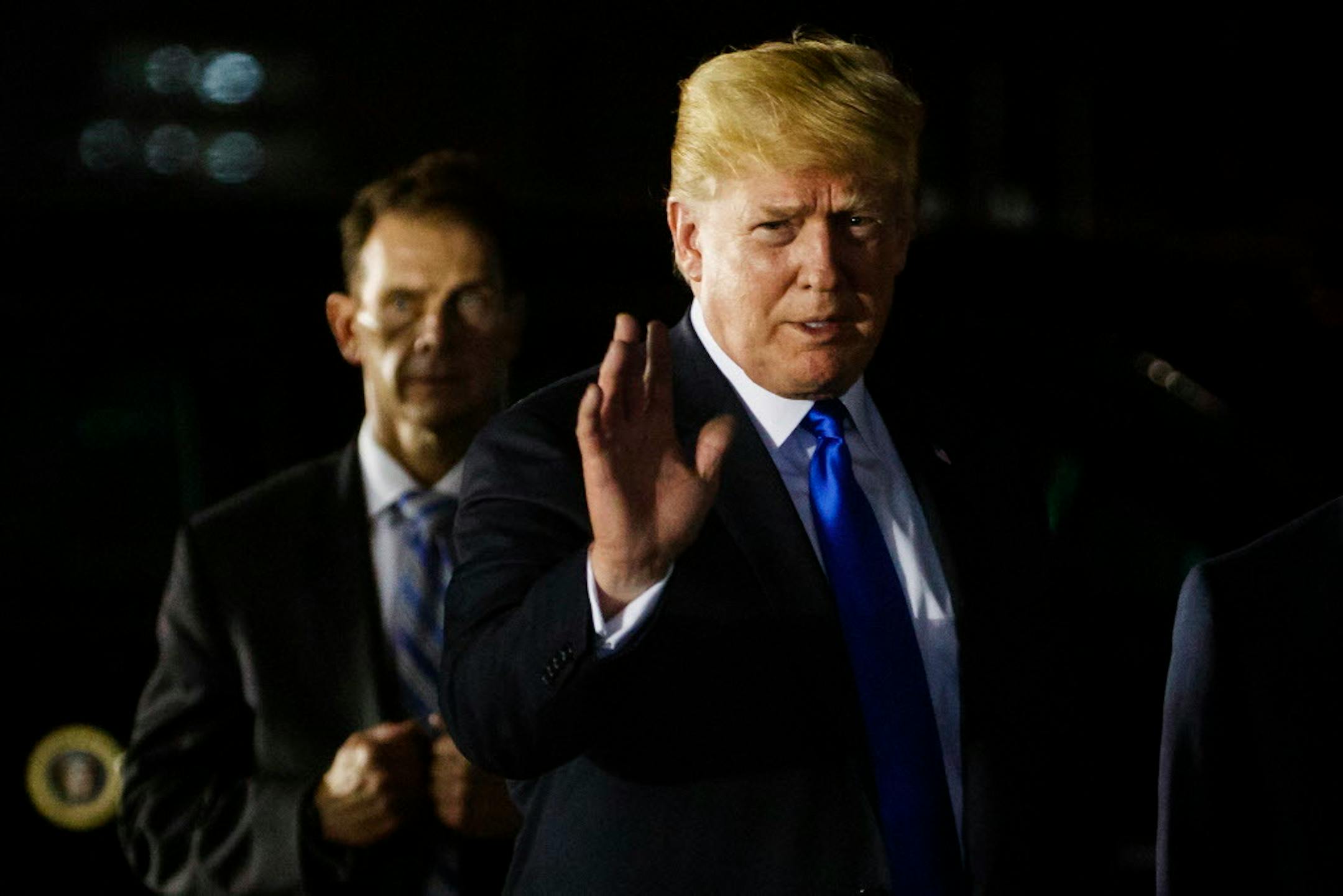 FILE - In this Sunday, June 10, 2018, file photo, U.S. President Donald Trump arrives at Paya Lebar Air Base for a summit with North Korean leader Kim Jong Un. (AP Photo/Evan Vucci, File)