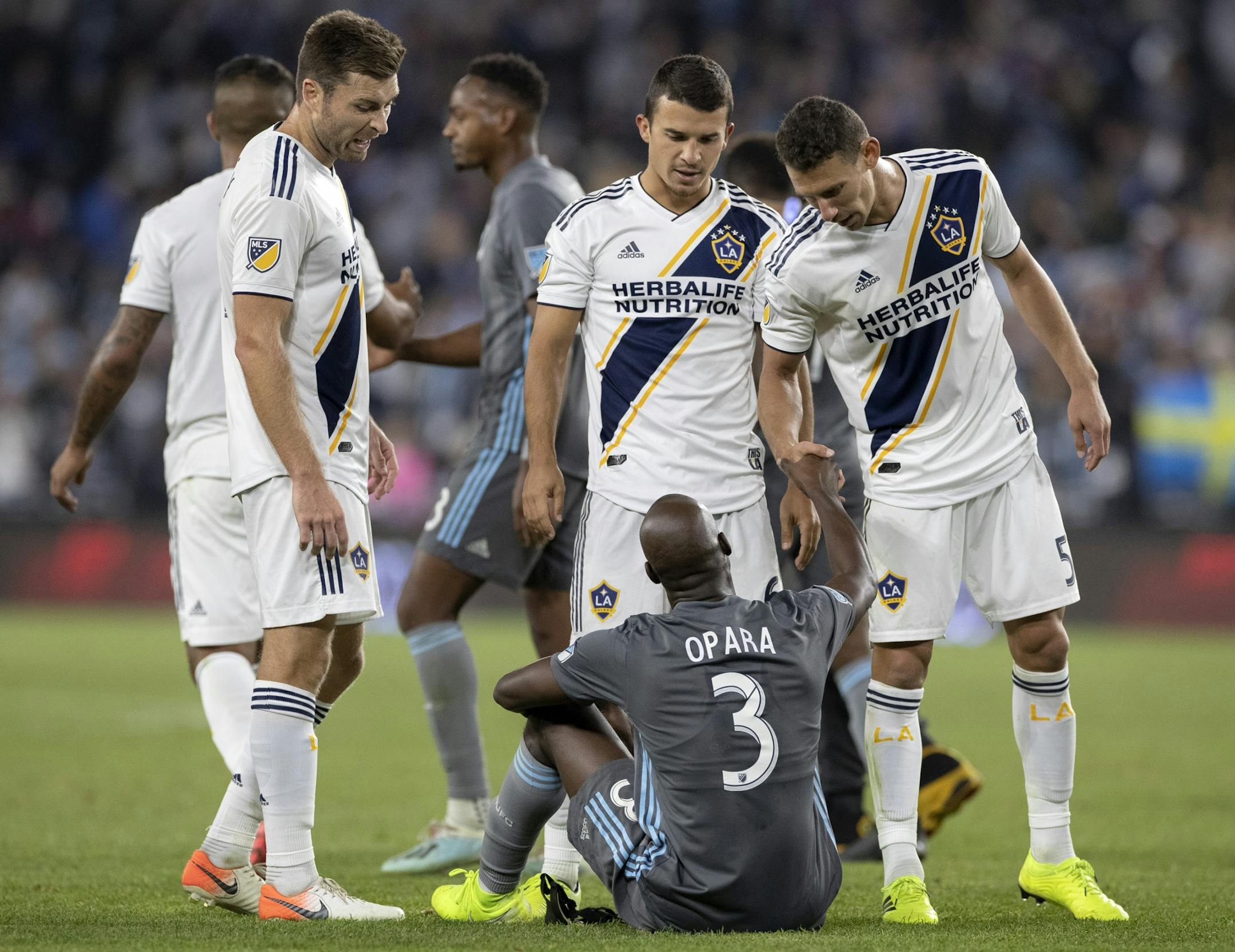 Loons defender Ike Opara, who was a key acquisition by Minnesota United this season, shook hands with L.A. Galaxy pkayers after Sunday's playoff loss.