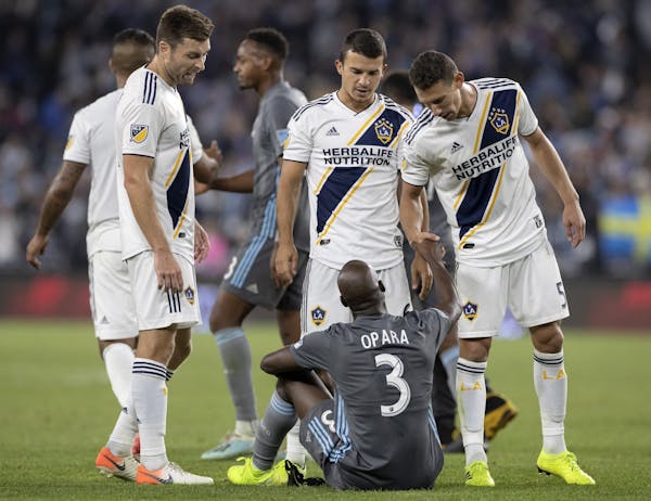 Loons defender Ike Opara, who was a key acquisition by Minnesota United this season, shook hands with L.A. Galaxy pkayers after Sunday's playoff loss.