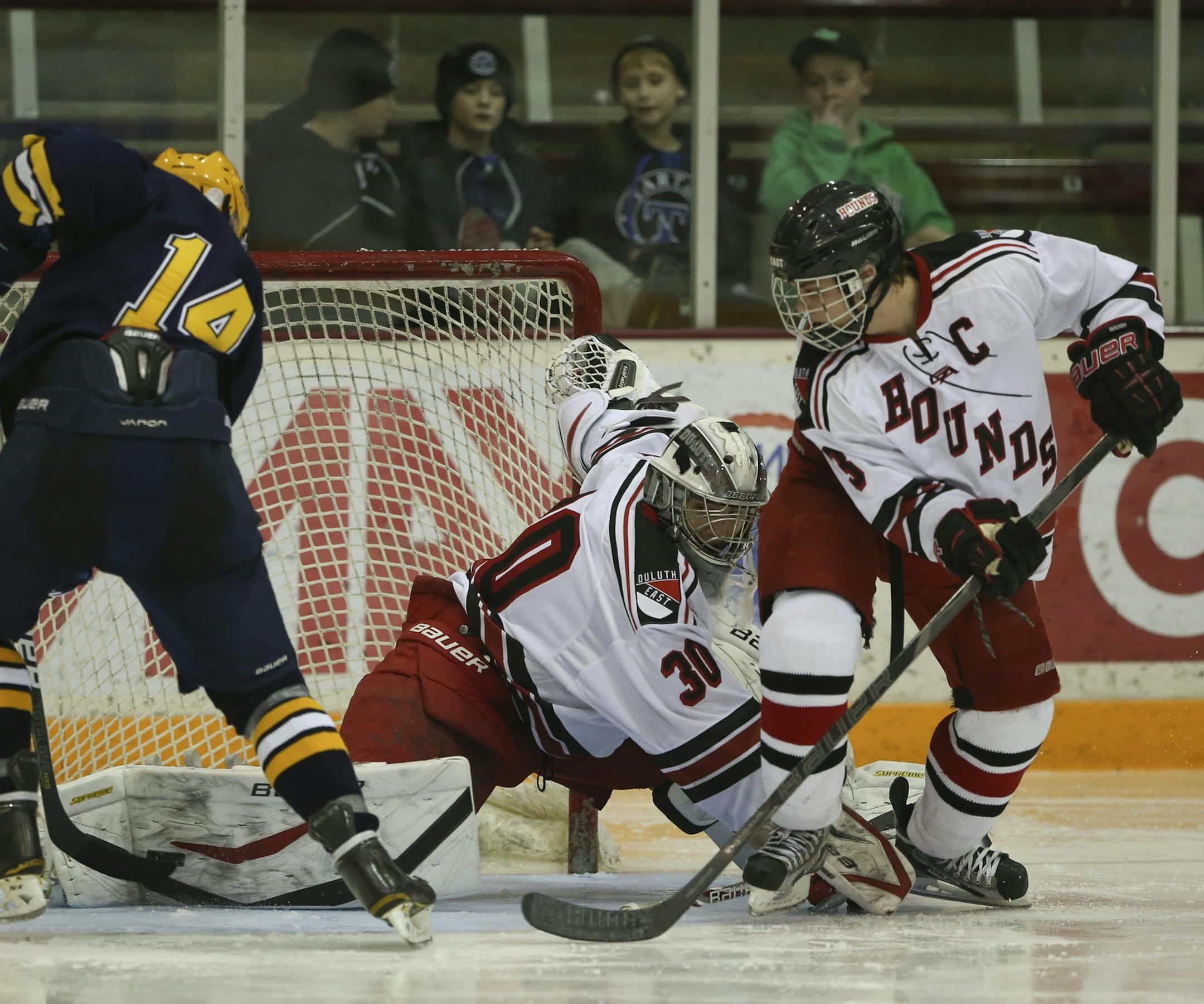Breck shut out Duluth East 2-0 in their Schwan Cup gold division hockey game Wednesday night, December 26, 2012 at Ridder Arena in Minneapolis, MInn. Breck's David Husband tried to shove the puck past Duluth East goaltender Dylan Parker in the third period. The Hounds' Andrew Kerr was at right. ] JEFF WHEELER ‚Ä¢ jeff.wheeler@startribune.com