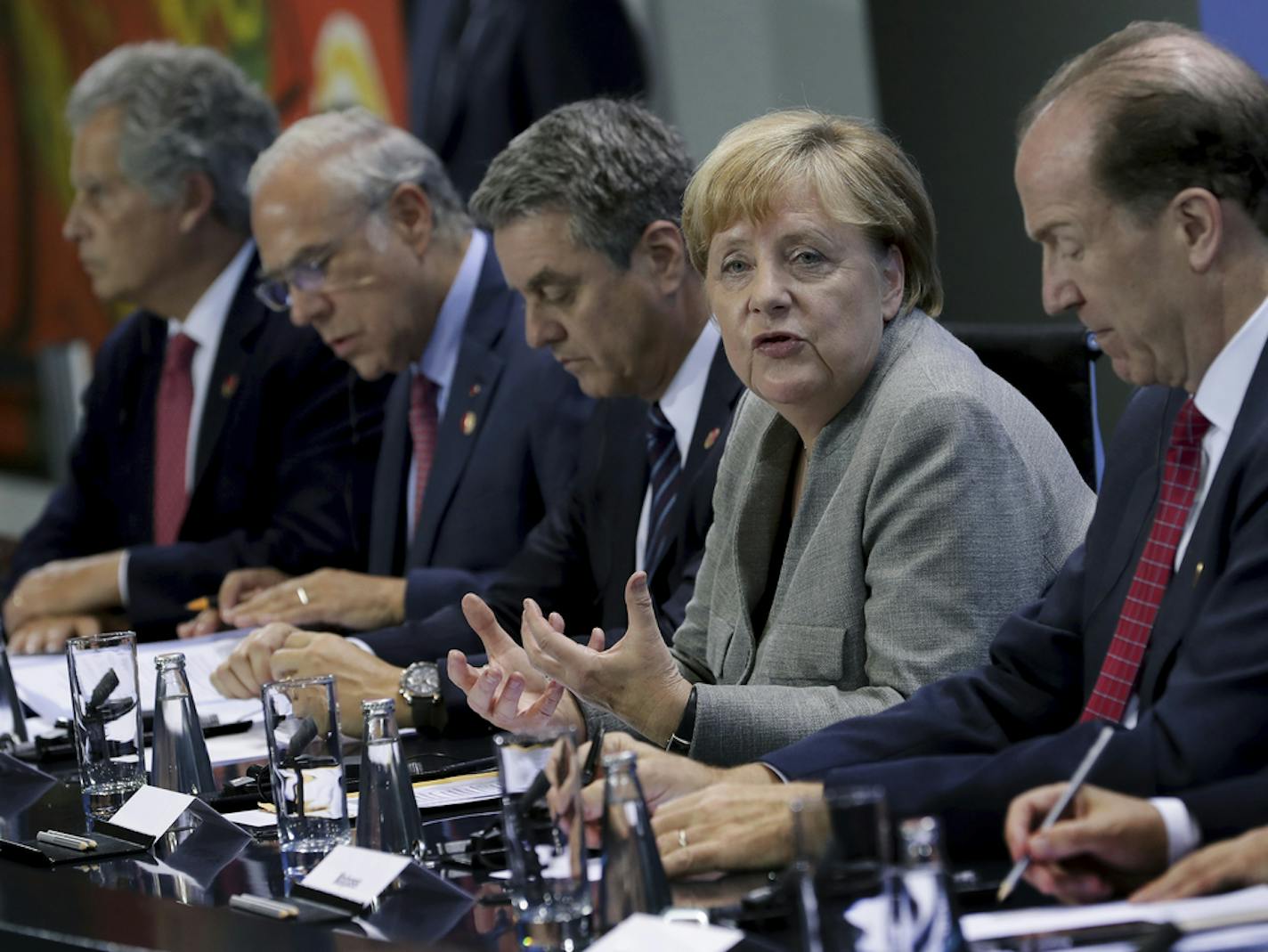 From left, David Lipton, deputy Managing Director of the International Monetary Fund (IMF), Jose Angel Gurria, Secretary General of the Organization for Economic Cooperation and Development (OECD), Roberto Azevedo, Director General of the World Trade Organization, Angela Merkel, German Chancellor, and David Malpass, President of the World Bank, address the media during a press conference after a meeting of the heads of international economy and finance organizations at the Chancellery in Berlin,