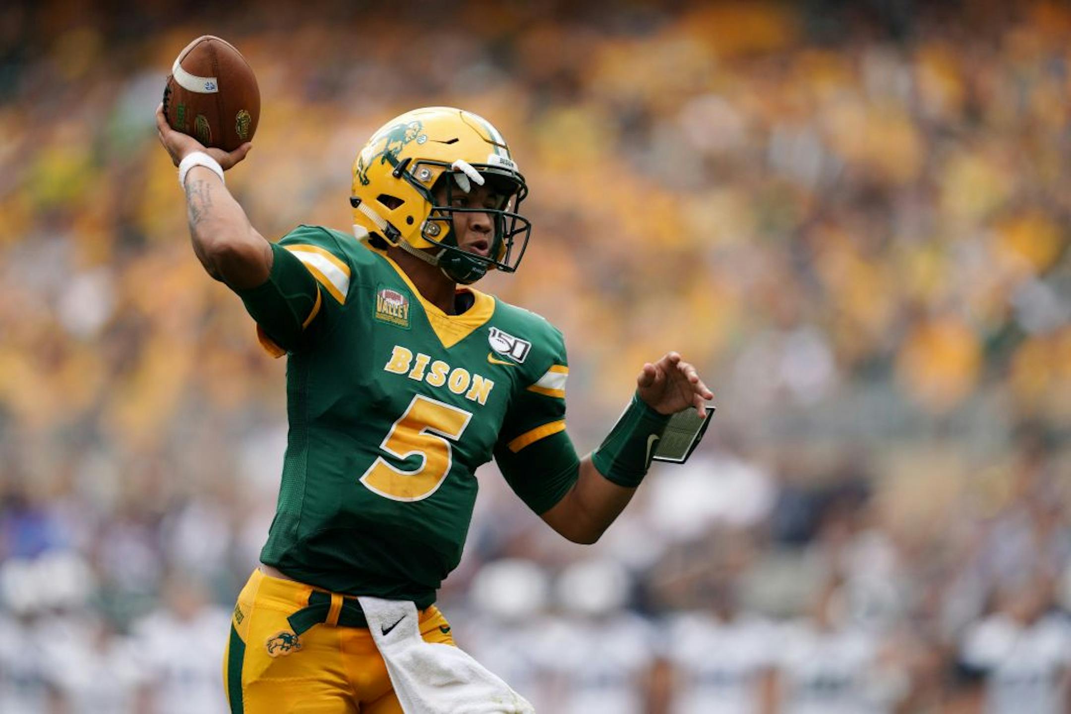 North Dakota State Bison quarterback Trey Lance (5) threw a touchdown pass to North Dakota State Bison tight end Josh Babicz (81) in the first half.