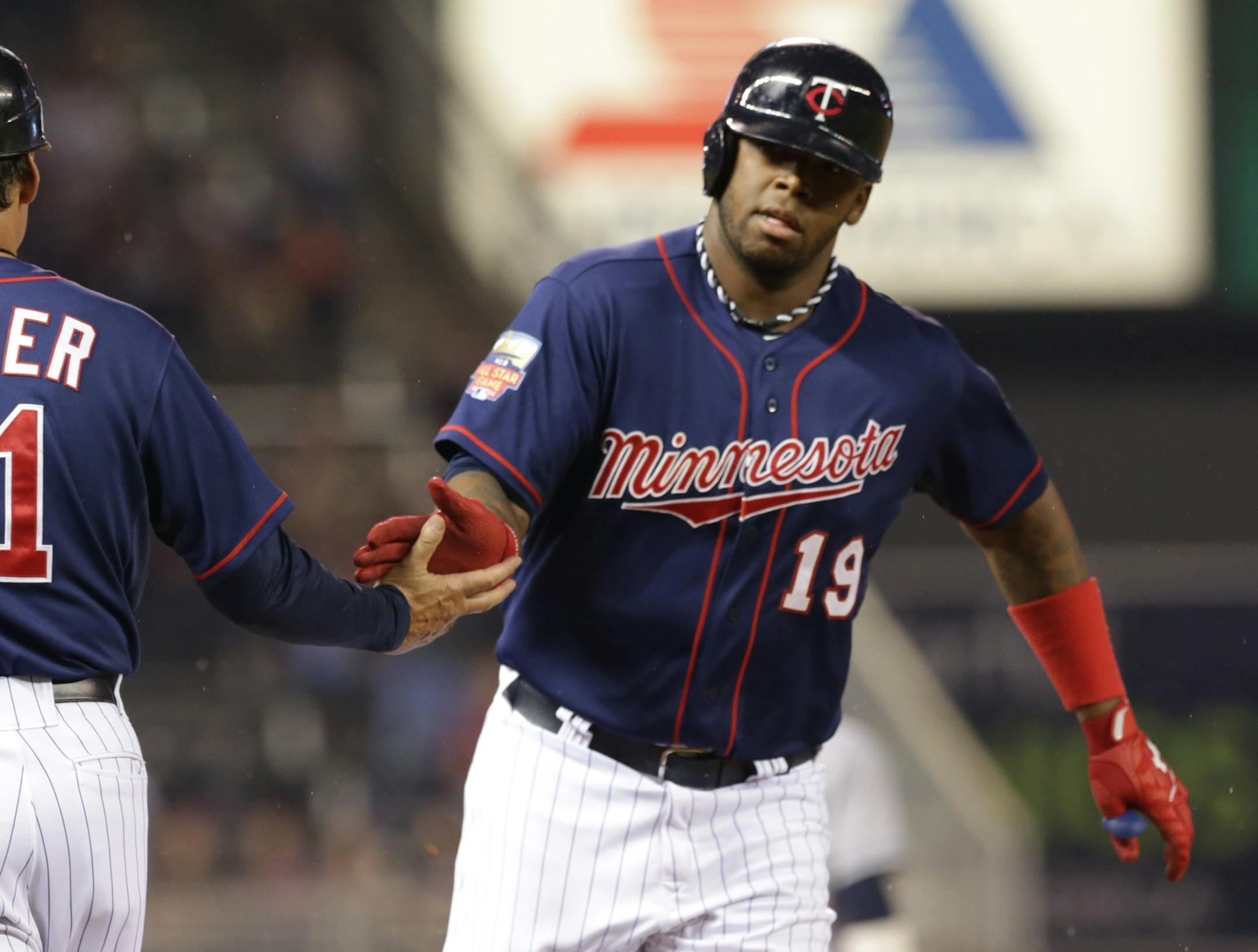 Minnesota Twins' Kennys Vargas rounds the base path on a solo home run off Cleveland Indians pitcher Trevor Bauer in the fourth inning of a baseball game, Friday, Sept. 19, 2014, in Minneapolis. (AP Photo/Jim Mone)