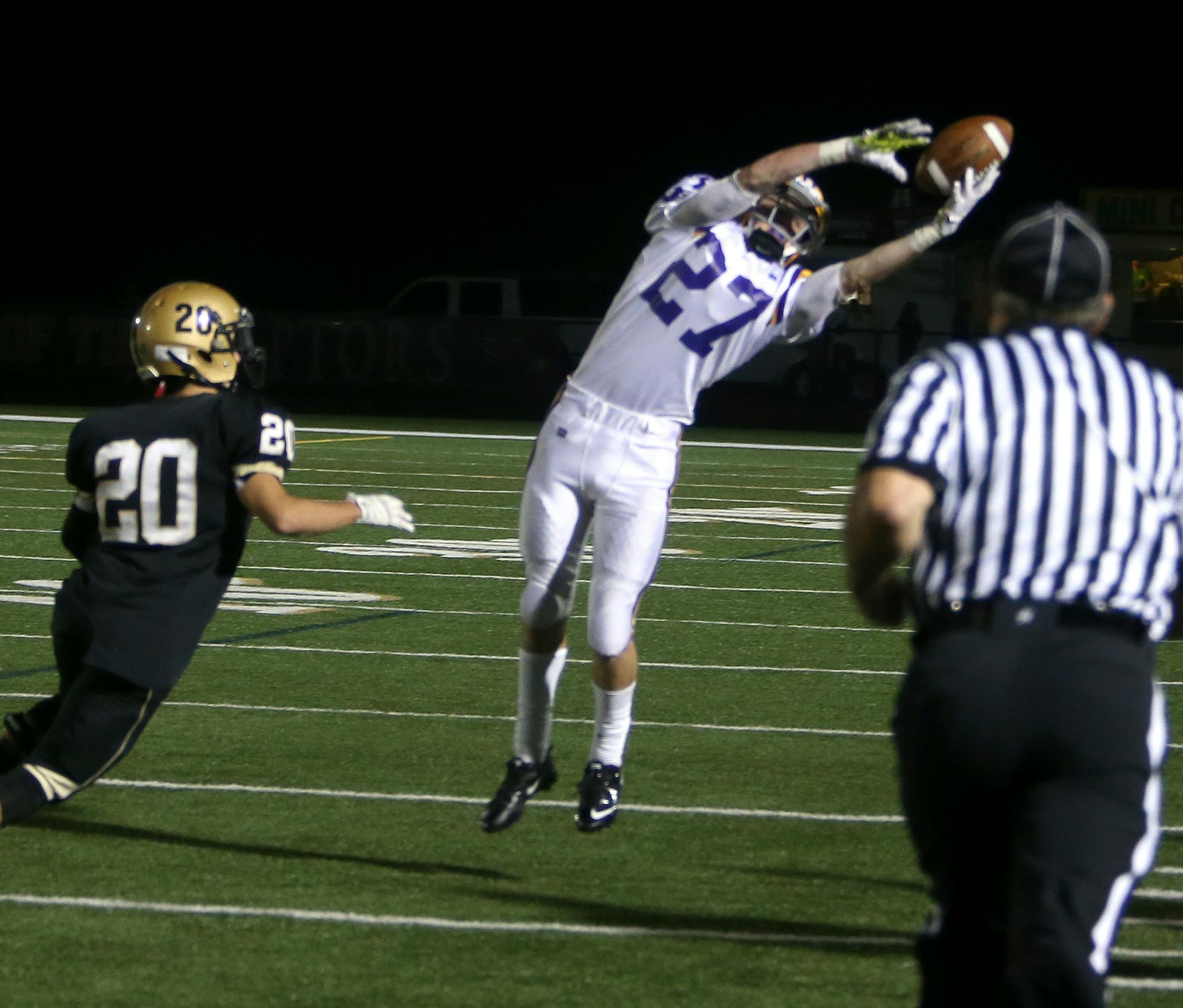 With about 2 minutes left in the game Ben Michaels (27) of Cretin Derham Hall makes a key catch in the 4th quarter as defender Jack Dwyer (20) looks on. Cretin-Derham Hall won 10-7 against East Ridge. Cretin-Derham Hall at East Ridge, Woodbury, MN. September 27, 2013. ] JOELKOYAMA‚Ä¢joel koyama@startribune JC Hassenauer of East Ridge, Jashon Cornell of Cretin-Derham Hall