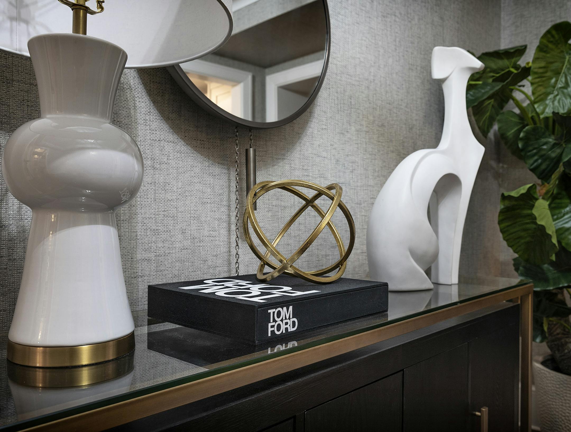 A dark foyer table helps ground an entry space. (Design Recipes/TNS)