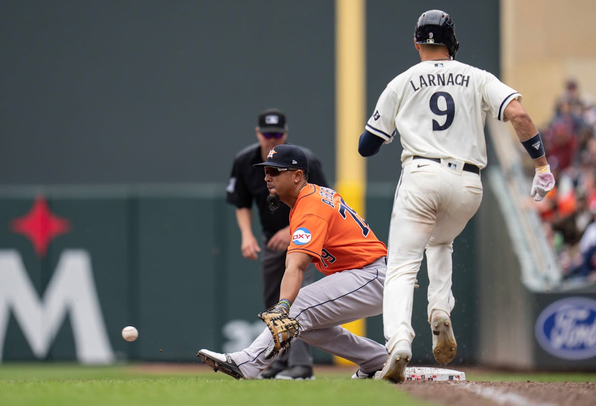 Houston Astros first baseman Jose Abreu (79) scoped the the ball of the grass getting Minnesota Twins left fielder Trevor Larnach (9) out in the 9th i