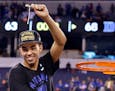 Tyus Jones cut down the net after Duke's 68-63 victory over Wisconsin in the 2015 Final Four championship game