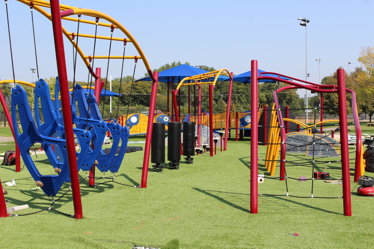 Workers put the finishing touches on the new challenge course at Schaper Park in Golden Valley this week. It is the first of its kind in the state.