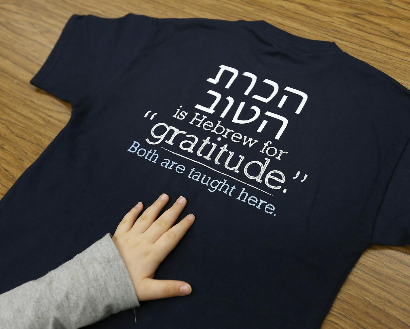 Some students received t-shirts during a tour of the Agamim Academy in Hopkins, Minn. The new charter school will open next fall and already has about 153 prospective students. ] CARLOS GONZALEZ cgonzalez@startribune.com, January 13, 2015, Hopkins, Minn., Feature on Agamim, the country's first Hebrew school to be taught via Classical Instruction, a specific teaching approach used at some charter schools. The school will open next fall in Hopkins and already has about 153 prospective students. On