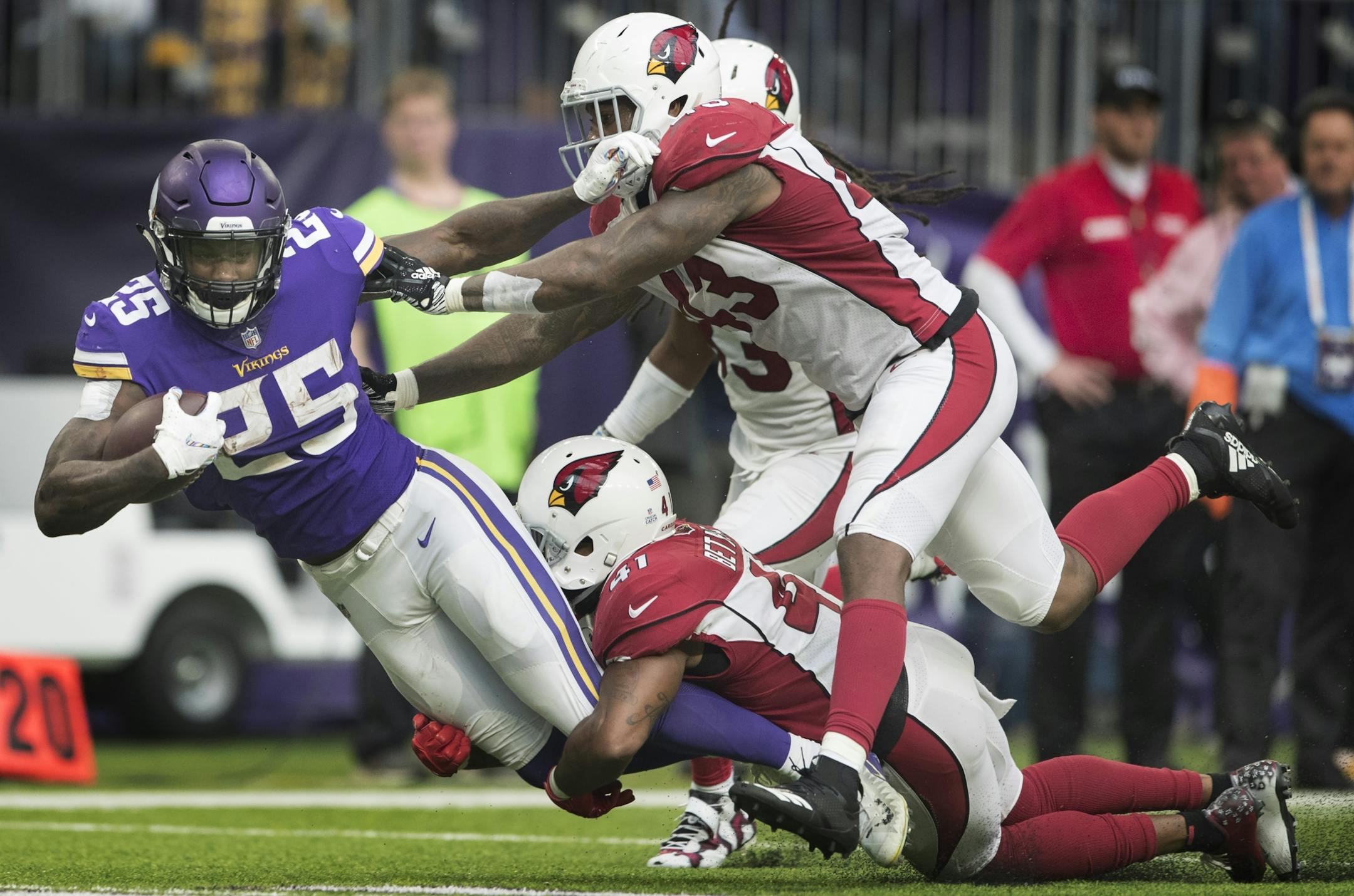 Minnesota Vikings running back Latavius Murray (25) was tackled by Arizona Cardinals free safety Antoine Bethea (41) after picking a first down in the third quarter at U.S. Bank Stadium Sunday October 14, 2018 in Minneapolis, MN.