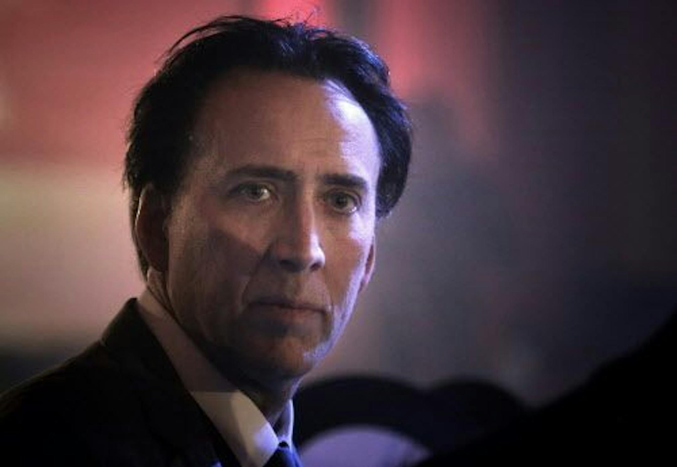 FILE -- Nicholas Cage looks on at a charity event in Bucharest, Romania, Saturday night, Oct. 30, 2010.