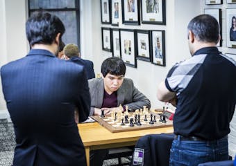 Wesley So, a grandmaster from Minnetonka, considers his next move while two rivals study the board during Round 6 of the U.S. Chess Championship at th