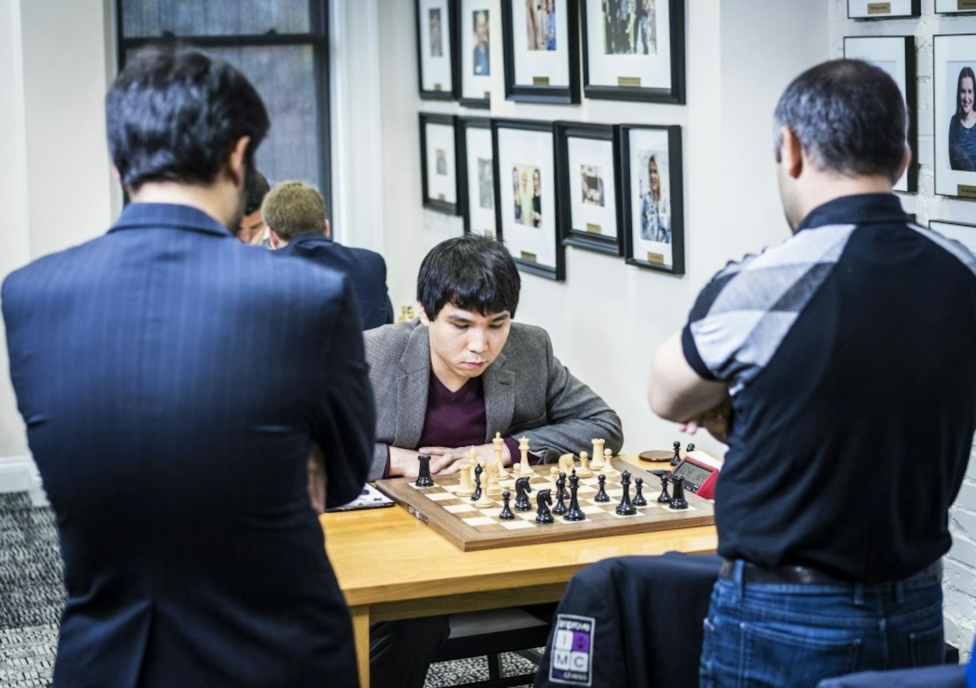 Wesley So, a grandmaster from Minnetonka, considers his next move while two rivals study the board during Round 6 of the U.S. Chess Championship at the Chess Club and Scholastic Center of St. Louis on April 4, 2017. Photo: Lennart Ootes, Chess Club and Scholastic Center of St. Louis