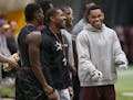 Former Gopher Damien Wilson, right, chatted as NFL scouts watched players' skills and abilities during Pro Day at the Nagurski building on campus in 2