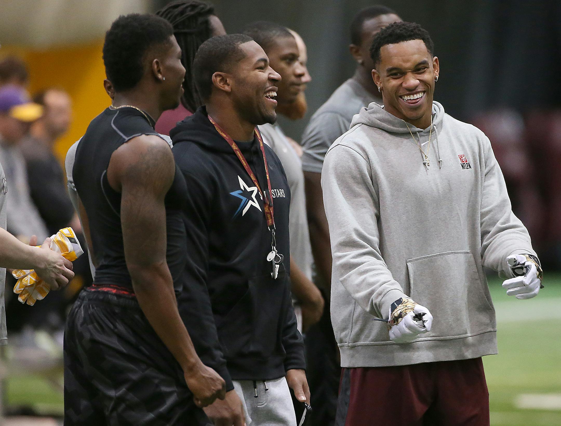 Former Gopher Damien Wilson, right, chatted as NFL scouts watched players' skills and abilities during Pro Day at the Nagurski building on campus in 2015.