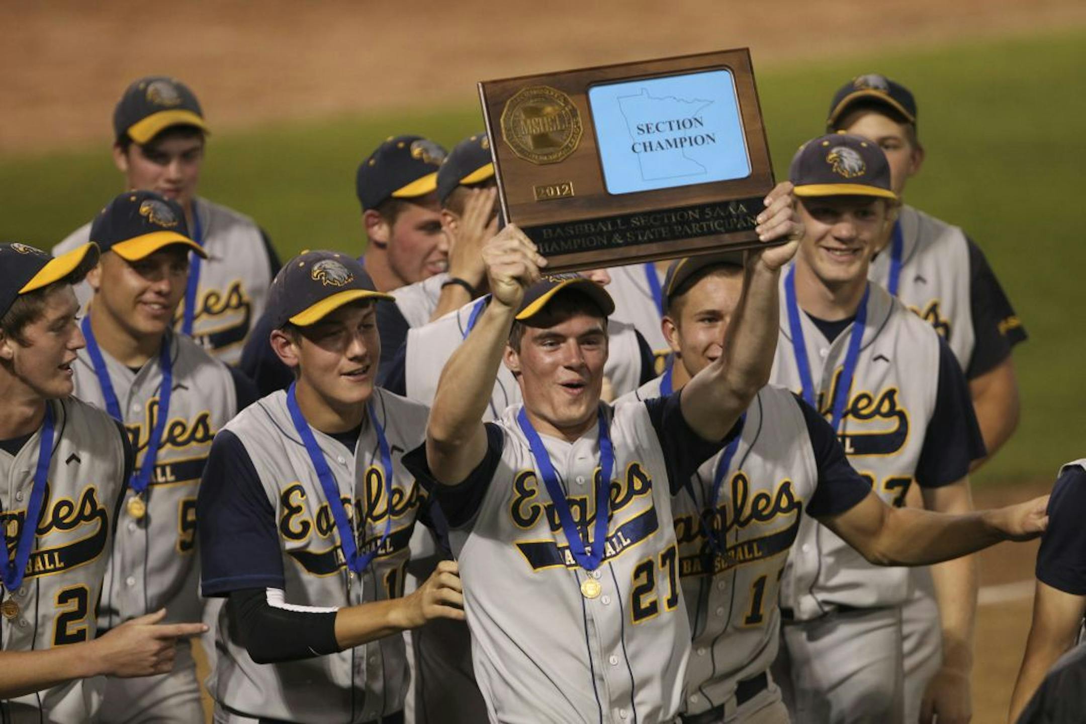Jacob Lentner held the championship trophy aloft last Wednesday after Totino-Grace won the section championship. The Eagles qualified for the state tournament for the second time in the program's history and the first time since 2006. Photo by Jeff Wheeler • jwheeler@startribune.com