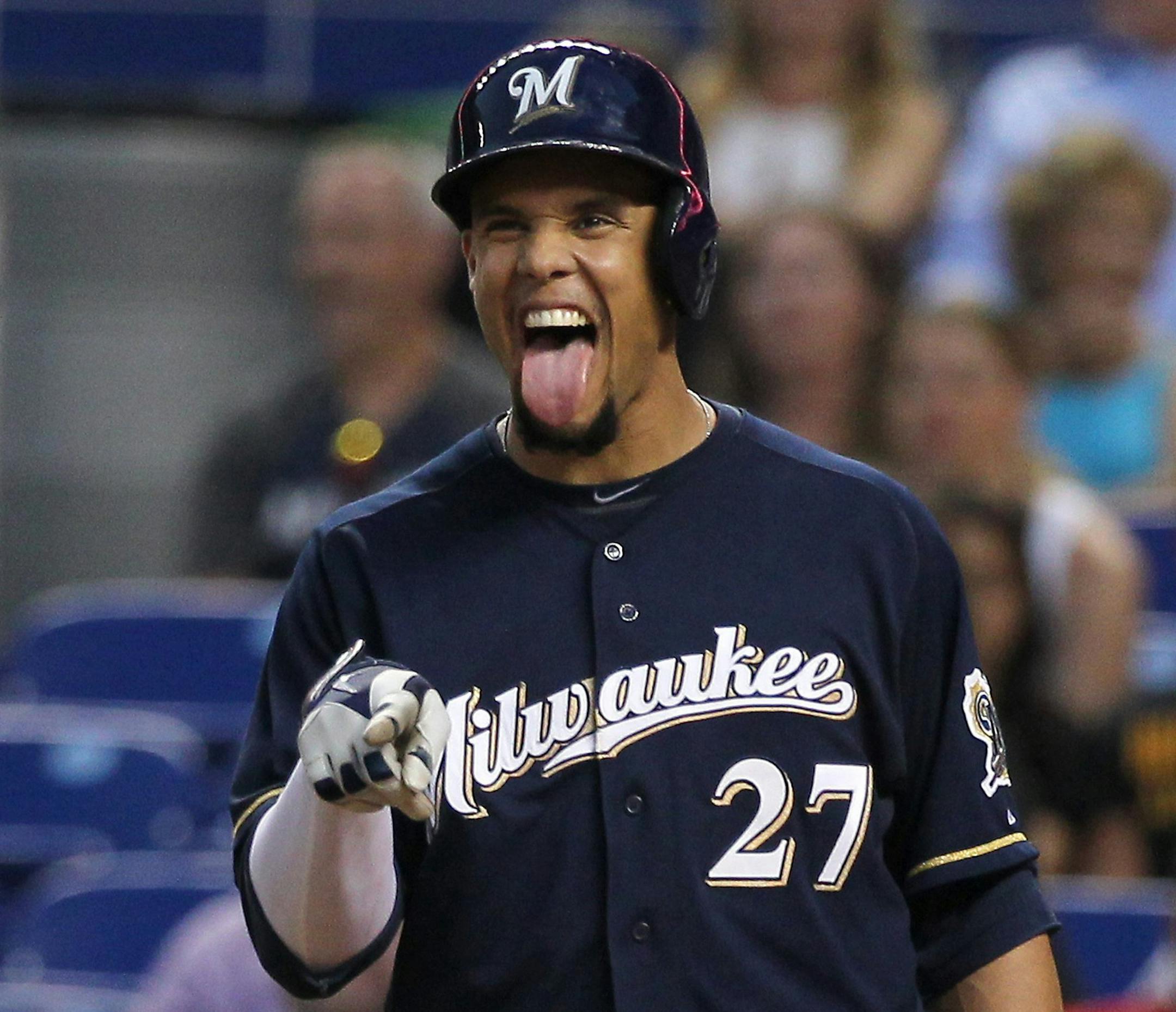 Milwaukee Brewers center fielder Carlos Gomez reacts after teammate third baseman Mark Reynolds hit two-run home run in the fourth inning against the Miami Marlins at Marlins Park in Miami, Friday, May 23, 2014. The Brewers defeated the Marlins, 9-5. (David Santiago/El Nuevo Herald/MCT) ORG XMIT: 1153267