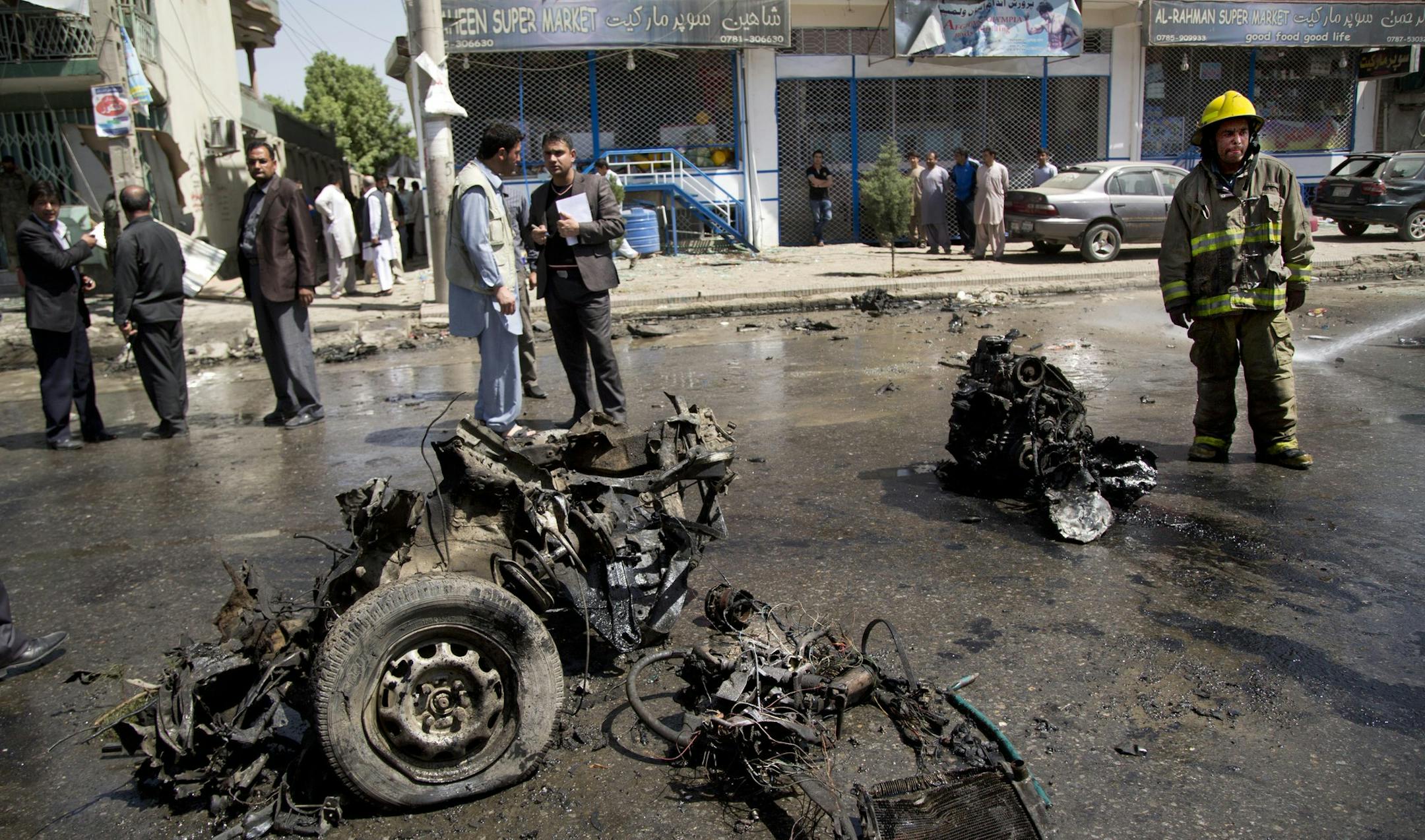 A fireman on Thursday stood next to the debris of a car at the scene where a suicide car bomber attacked a U.S. convoy during rush hour in Kabul, Afghanistan. Militants said a new suicide unit was formed to target Americans.