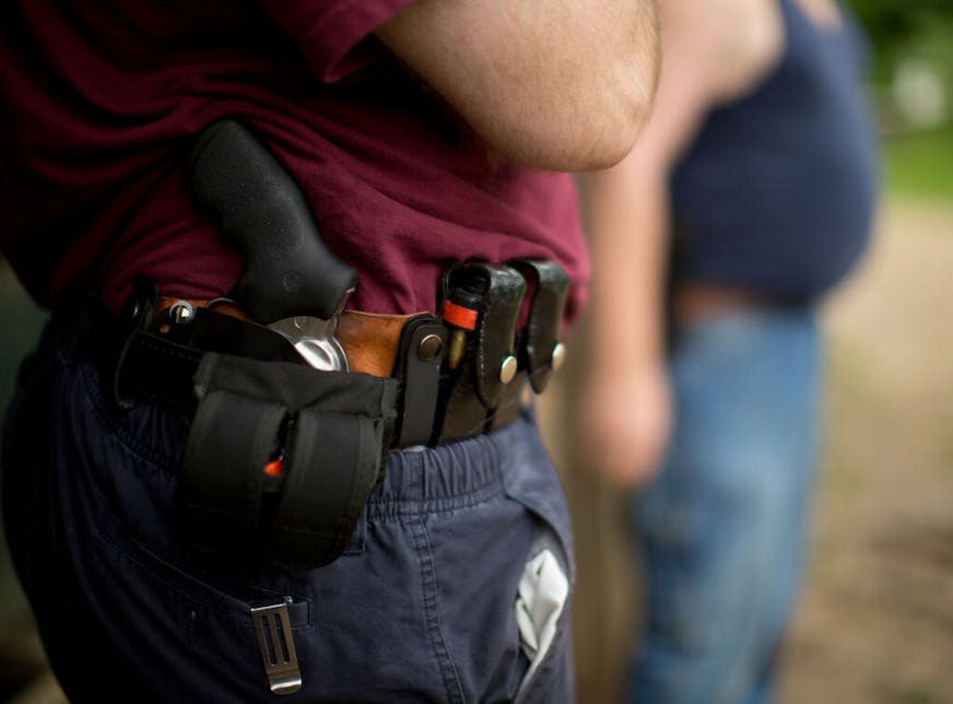 Pat Cannon, 59, of Minneapolis, is representative of the population who have qualified for concealed carry pistol permits in Minnesota. He bought a handgun, got trained and got his permit both for protection and for the enjoyment of shooting in competitions. Wednesday night, June 20, 2012, he shot in a pistol competitive league at the Faribault Rifle &amp; Pistol Club in Kilkenny. Pat Cannon's Ruger revolver was holstered inside his belt while he was between shooting stations in his league on June 20, 2012. ] JEFF WHEELER â€¢ jeff.wheeler@startribune.com